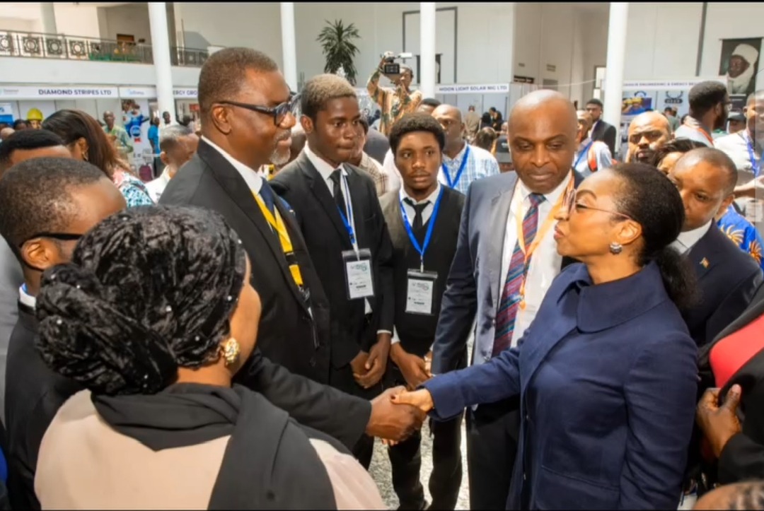 Delegates greeting each other on the forum floor